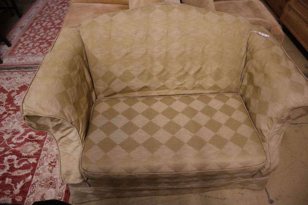 A small upholstered two seater camel back settee with loose pale green cover, length 150cm, depth 88cm, height 84cm